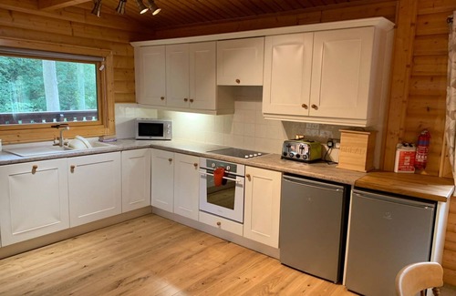 Louth Cabin | Log cabin with veranda, nestled in Kenwick Park, Louth