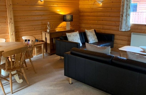Louth Cabin | Log cabin with veranda, nestled in Kenwick Park, Louth