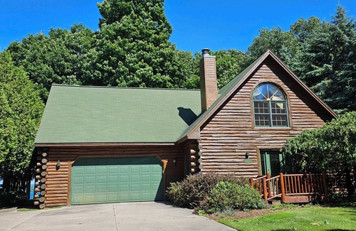 Kewadin House | Log home overlooking Torch Lake