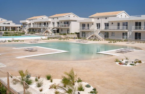 Pachino Apartment | Lovely 40 sqm seaview apartment, able to accommodate up to 4 people, located inside the renowned Borgo 84 residence, equipped with swimming pool and cycle path. The property is located just 3 km from the center of Marzamemi, one of the most fascinating s