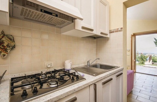 Fornole Apartment | Lovely apartment for 4 guests with WIFI, A/C, pool, TV and veranda