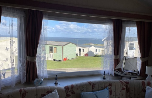 Flamborough House | Lovely caravan holiday home in a beautiful coastal setting.