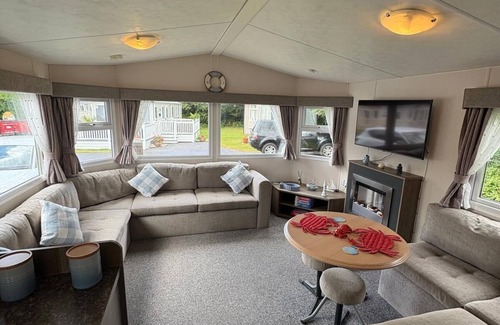 Newquay House | Lovely caravan with decking at Newquay Holiday Park, Cornwall, ref 93008H