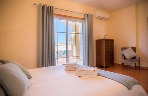 Atalaia Villa | Lovely detached villa overlooking the large communal pool in Colina da Atalaia.