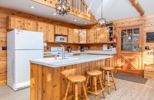 Eagle River House | Lovely lakefront gem with private dock, large deck, & free WiFi - dog-friendly