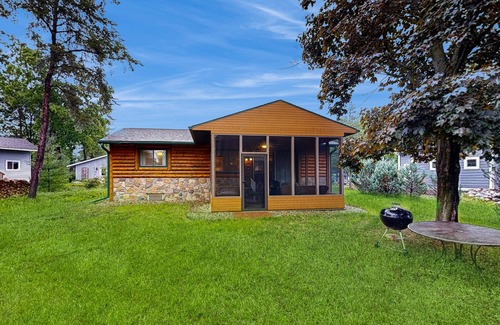 Nekoosa House | Lovely lakefront home with a game room, firepit, dock & W/D - private beach area