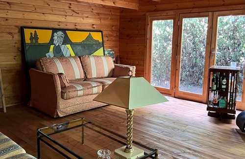 San Martino in Rio Cottage | Lovely wooden accommodation surrounded by greenery