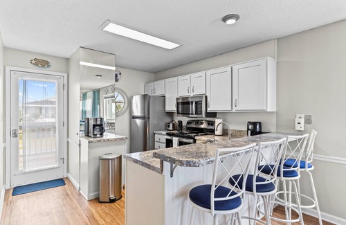 Holden Beach Condo | Lower Waterfront Condo with Oceanfront Balcony, Shared Outdoor Pool, WiFi & AC