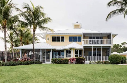 Palm City House | Lush Waterfront Pool Home and Pool house with Pickleball court and Boat dock