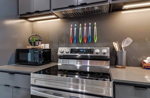 Downtown Apartment | Lux Downtown Flat with Gameroom & Fire Pit