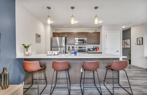 Gateway District Apartment | Luxe 1B in Heart of Downtown Pool & Spa Gym