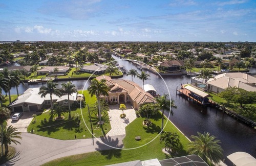Caloosahatchee Villa | Luxe Canal Villa! Direct Gulf access pool home, sleeps up to 15.