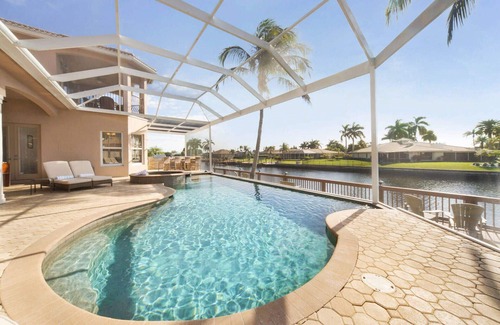 Caloosahatchee Villa | Luxe Canal Villa! Direct Gulf access pool home, sleeps up to 15.