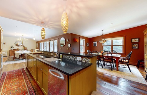 Warren House | Luxe custom home with hot tub, game room, & beautiful garden