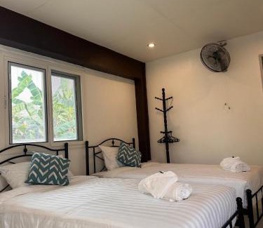 K. Phu Pieng Bed & Breakfast | Luxe Nan Twin Bed Room