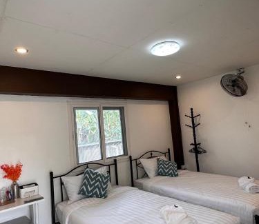 K. Phu Pieng Bed & Breakfast | Luxe Nan Twin Bed Room