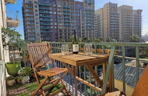 Downtown Long Beach Condo | Luxe Suite one bedroom with free parking, balcony and partial ocean view.
