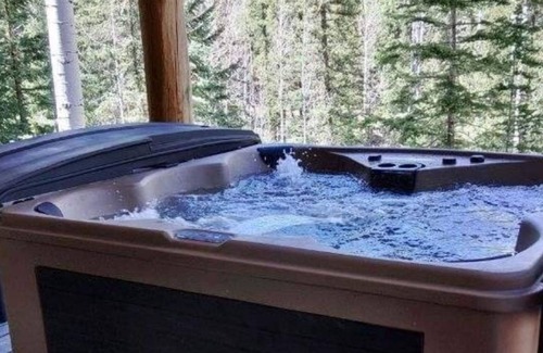 Greer House | Luxurious wood cabin nestled in the woods with patio& hot tub
