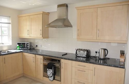 South Cerney House | Luxury 3 bedroom lakeside turret lodge with private wrap around deck