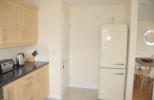 South Cerney House | Luxury 3 bedroom lakeside turret lodge with private wrap around deck