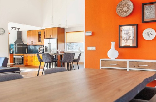 Makkum Cabin | Luxury 6-person beach villa with a sauna, bathtub, and balcony overlooking the IJsselmeer at Beach Resort Makkum.