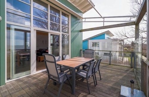 Makkum Cabin | Luxury Beach Villa with balcony, terrace, fireplace, and panoramic IJsselmeer views at Beach Resort Makkum.