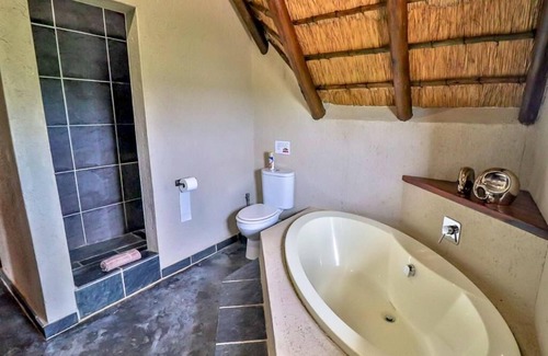 Marloth Park Ski Chalet | Luxury chalet 12 mi from the Crocodile Bridge Gate of the Kruger National Park!