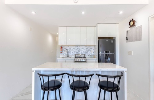El Medano Ejidal Apartment | Luxury condo with shared gym, rooftop pool, and centrally located