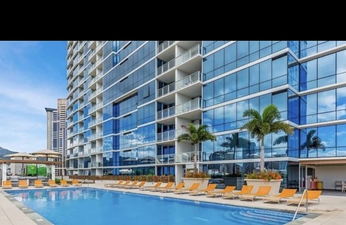 Downtown Honolulu Apartment | Luxury Condo with full view of the Ocean, Lanai, Pool, Hot Tub, Gym & Playground