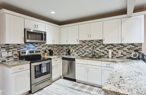 Sun Bay South House | Luxury Dream Getaway: Heated Pool House in Prime Location!