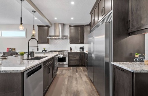 Southeast Calgary House | Luxury Group Home Karaoke, Games & Sleeps 14