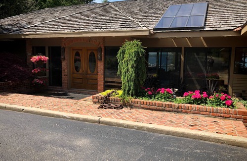 Charlevoix House | Luxury Lakefront Property with private dock, tennis court, trails & views