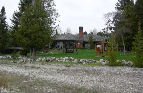 Charlevoix House | Luxury Lakefront Property with private dock, tennis court, trails & views