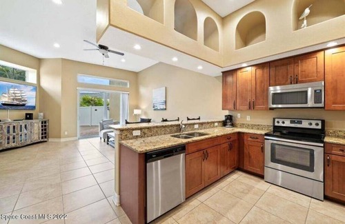 Indian Harbour Beach House | Luxury Mediterranean villa with courtyard by the beach where you eat, play love.