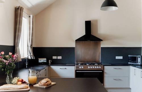 Devils Bridge House | Luxury renovated barn with a large hot tub and games room. Sleeping 16