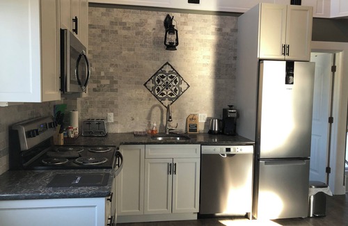 Inner Harbour Apartment | Luxury, top floor suite with free parking space. Walking distance to downtown!