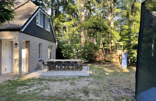 Lochem House | Luxury vacation home with bar billiards and sauna in wooded area
