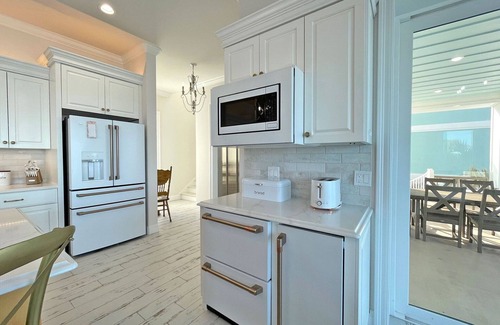 Pensacola Beach House | Luxury Water Front Home with a Private (Heated) Pool & Swim-up Bar!