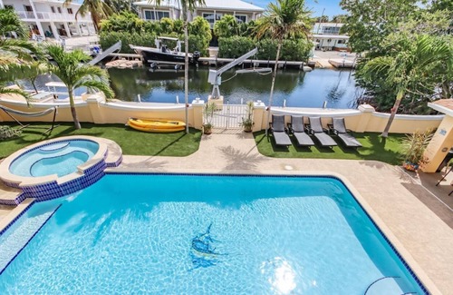 Twin Lakes House | Luxury Water Front Home, Private Pool, Spa, Tiki Bar, 37' Foot Dock with Kayaks