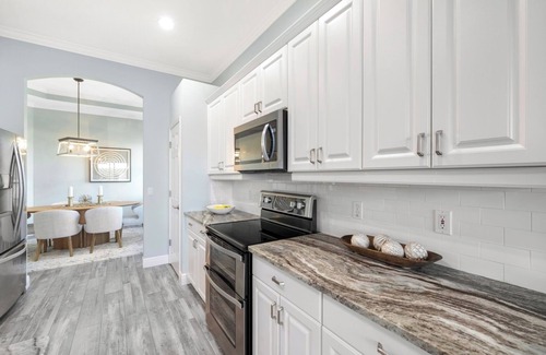 Miromar Lakes Condo | Luxury Waterfront Rental with wraparound water views at Miromar Lakes,