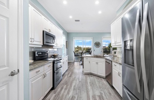 Miromar Lakes Condo | Luxury Waterfront Rental with wraparound water views at Miromar Lakes,