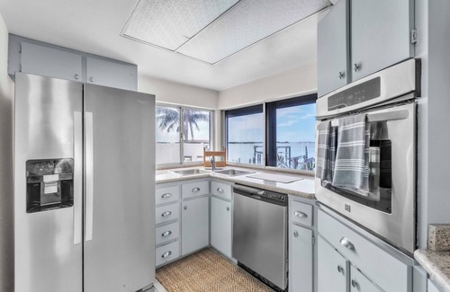 St. Petersburg - Clearwater House | Luxury Waterfront Farmhouse Retreat w/Saltwater Pool, Dock & Tiki Bar