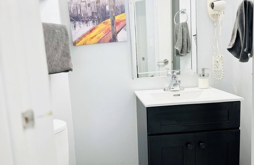 Saskatoon House | Main Central Avenue Basement Studio