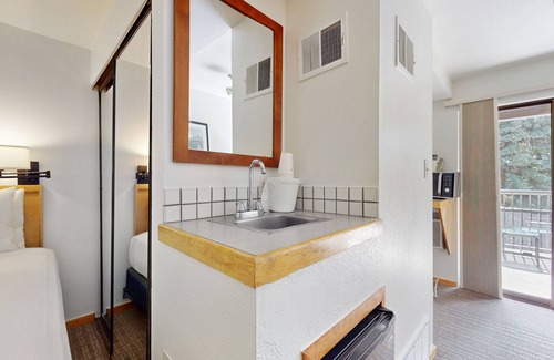 West End Cabin | Main St. studio - pool & hot tub - walk to lifts, dog-friendly, private balcony