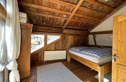 Sent Apartment | Maisonettewohnung im Alpenstil mit 360 Grad Kamin