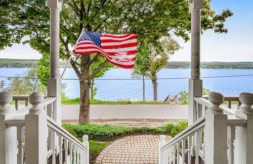 Town of Milo House | Majestic lakefront dog-friendly home with game room, fireplace, partial AC