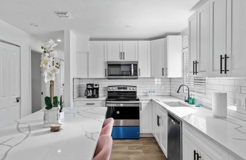 Sun Bay South House | Manhattan- A clean, modern 4-bedroom home in the heart of South Tampa. Sleeps up to 10, with a fenced backyard, BBQ grill, and firepit. Great for families, groups, or work stays. Minutes to Picnic Island Park, downtown Tampa, and the beaches.n
