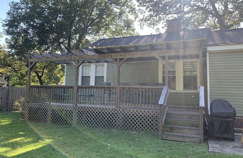 Pendleton King House | Masters rental with spacious back porch, fenced in yard, and park frontage.