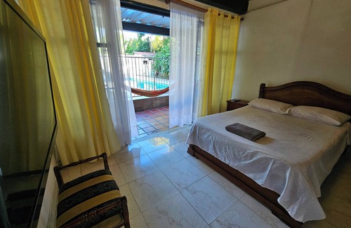 Garzon Bed & Breakfast | Matrimonial Suite - Exclusive area with hammock in front of the Swimming Pool