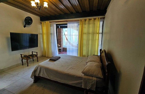 Garzon Bed & Breakfast | Matrimonial Suite - Exclusive area with hammock in front of the Swimming Pool